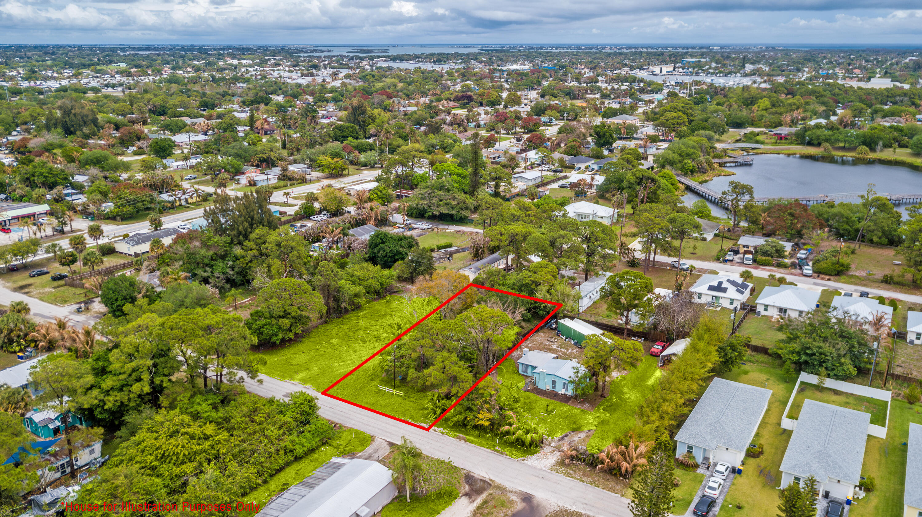 5167 Southeast Isabelita Avenue Stuart, FL 34997 - Photo 1 of 9 an aerial view of residential houses with outdoor space