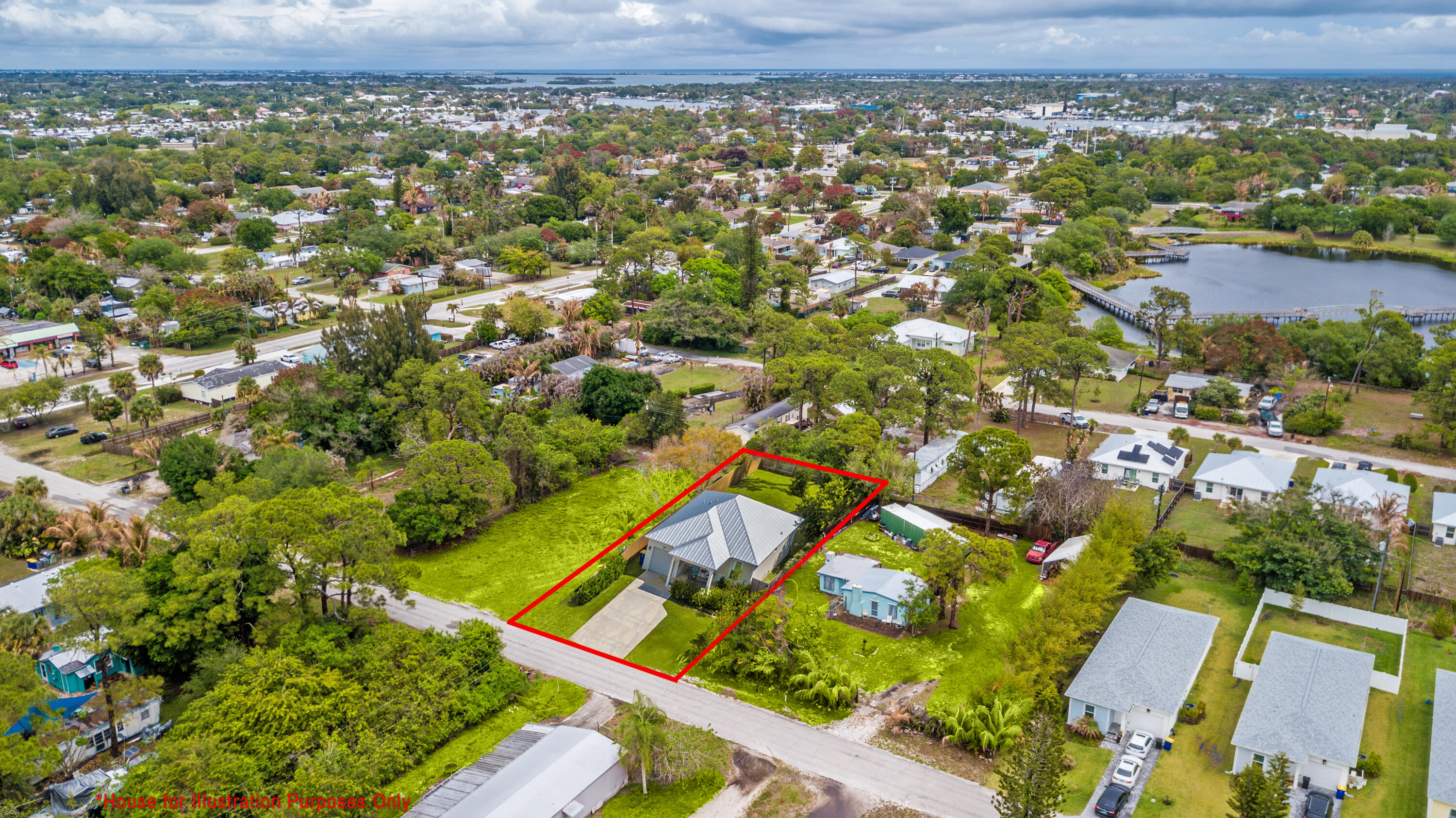5167 Southeast Isabelita Avenue Stuart, FL 34997 - Photo 4 of 9 an aerial view of residential houses with outdoor space