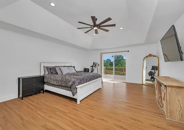a view of balcony with wooden floor and fence