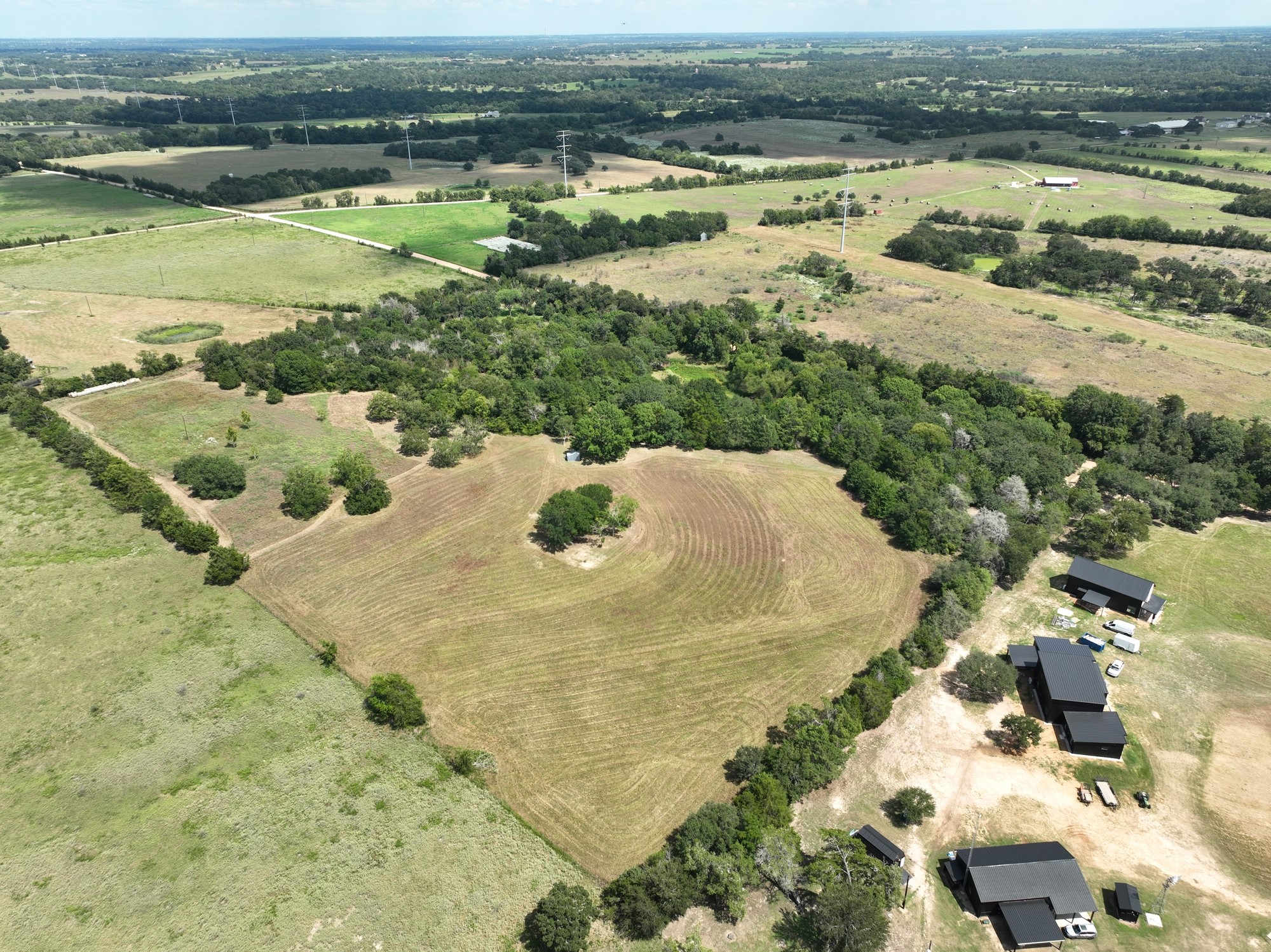 7515 Shelby Road Burton, TX 77835 - Photo 4 of 26 an aerial view of residential houses with outdoor space