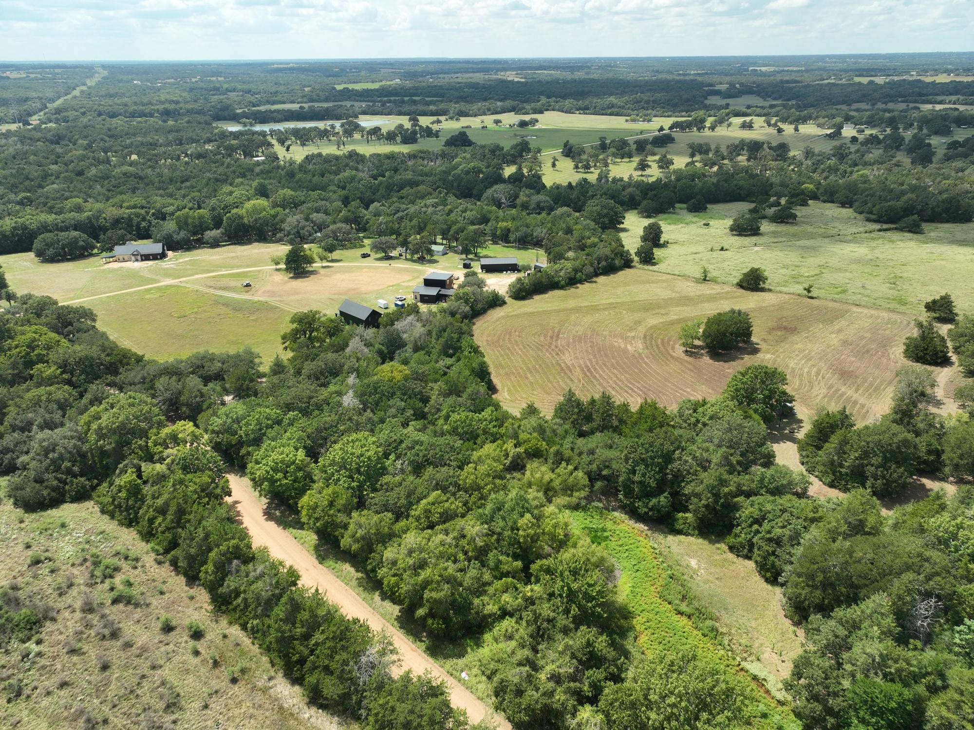 7515 Shelby Road Burton, TX 77835 - Photo 10 of 26 a view of a lake with a mountain