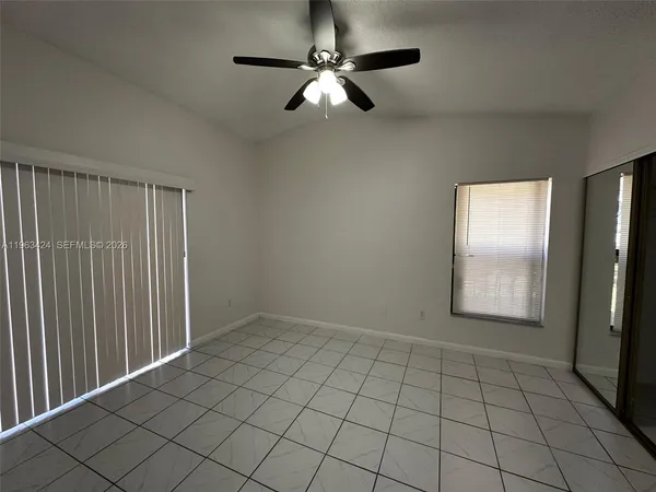 a view of an empty room and window