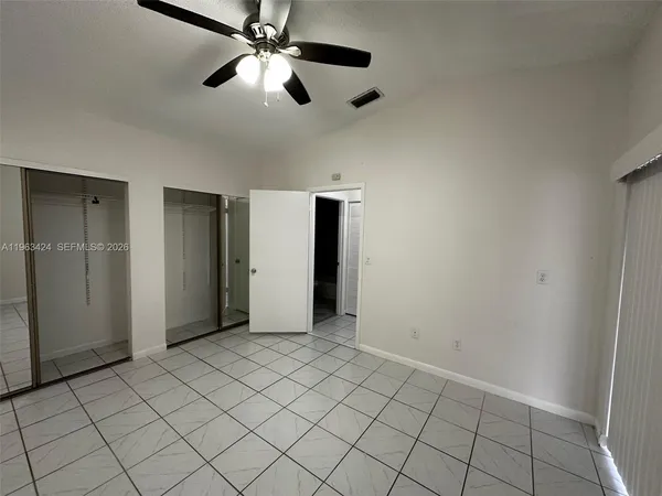 a view of an empty room and window