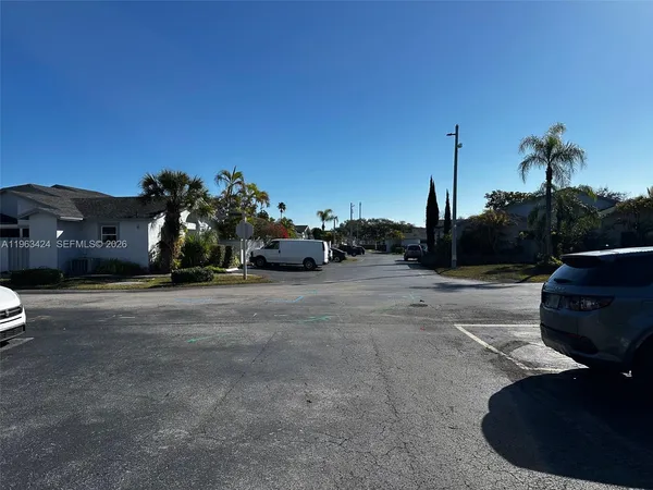 a view of street with parked cars