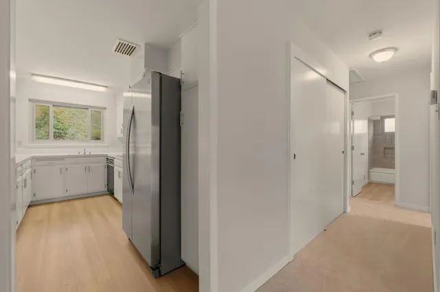 a bedroom with bed and a window