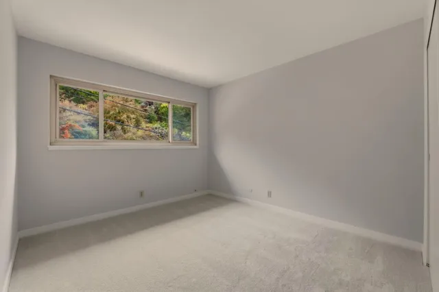 an empty room with entrance door