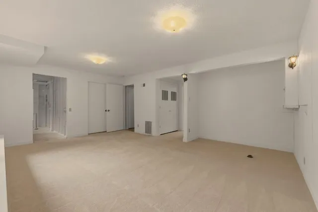 a view of hallway with bathroom