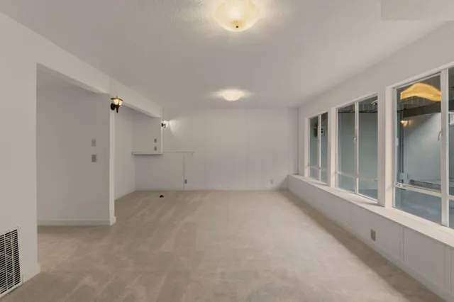 a bathroom with a toilet sink and shower