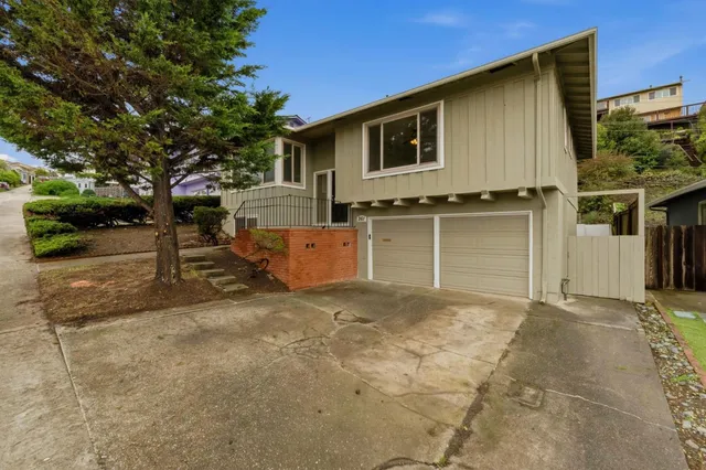 a front view of a house with garage