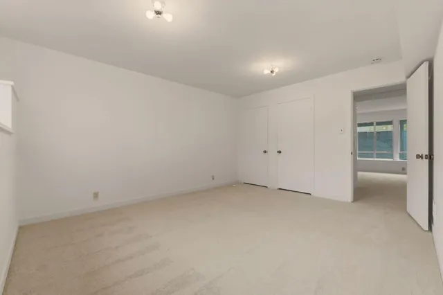 a bathroom with a bathtub and a window