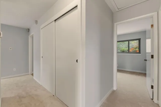 a view of a bathroom with a tub and shower