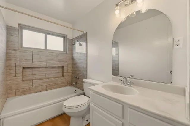 a view of a house with wooden deck