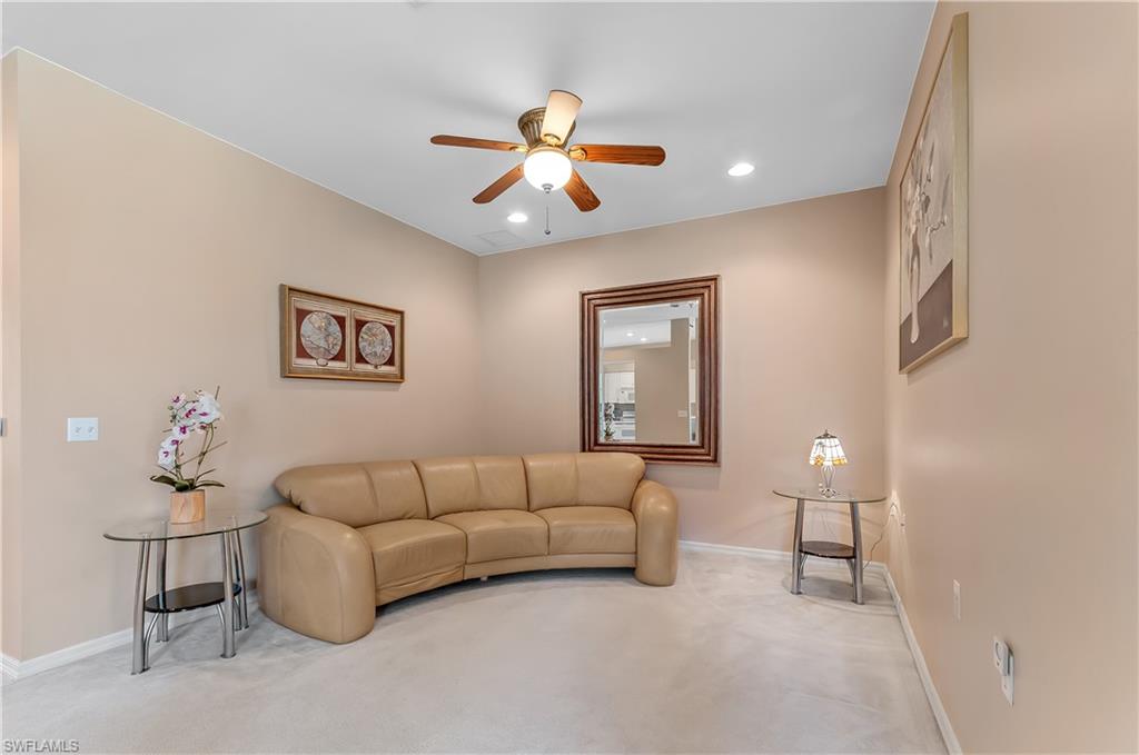 21520 Portrush Run Estero, FL 33928 - Photo 11 of 34 a living room with furniture and a chandelier