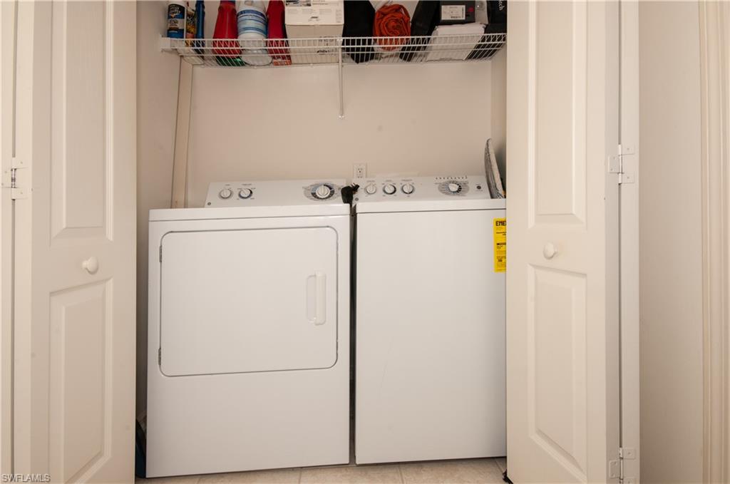21520 Portrush Run Estero, FL 33928 - Photo 17 of 34 a utility room with dryer and washer