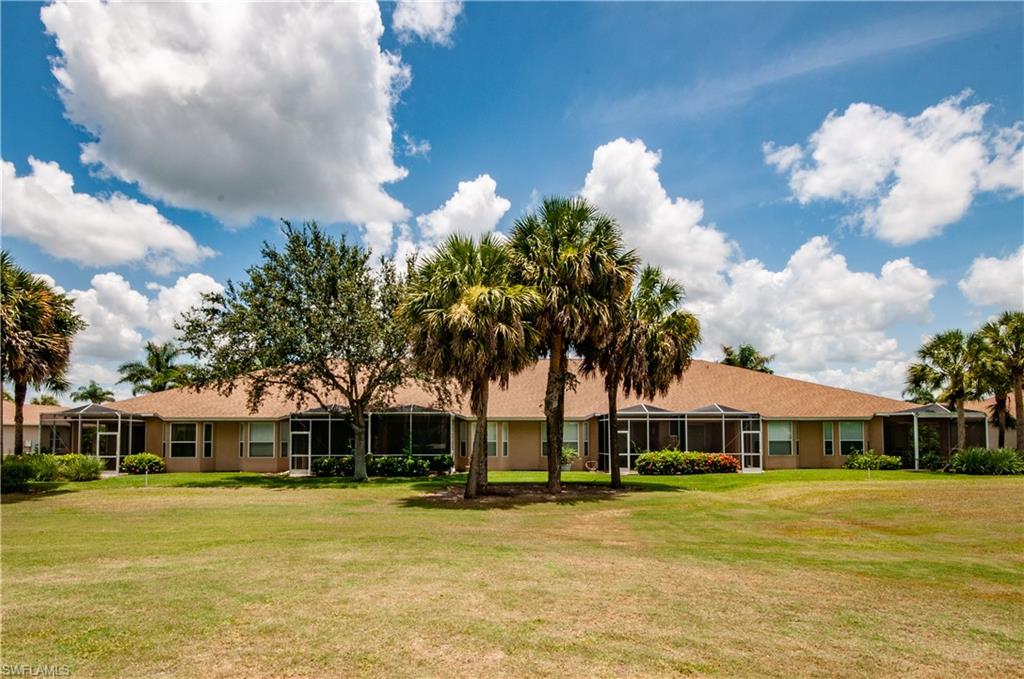 21520 Portrush Run Estero, FL 33928 - Photo 20 of 34 a front view of a house with swimming pool