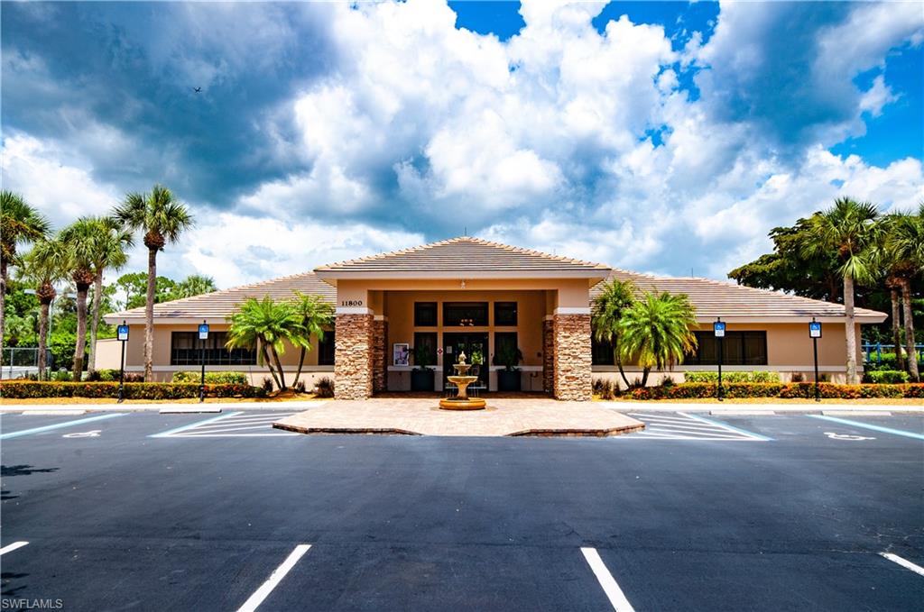 21520 Portrush Run Estero, FL 33928 - Photo 24 of 34 a front view of building with small garden