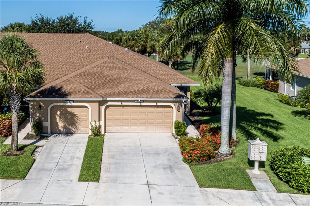 21520 Portrush Run Estero, FL 33928 - Photo 3 of 34 a front view of a house with garden