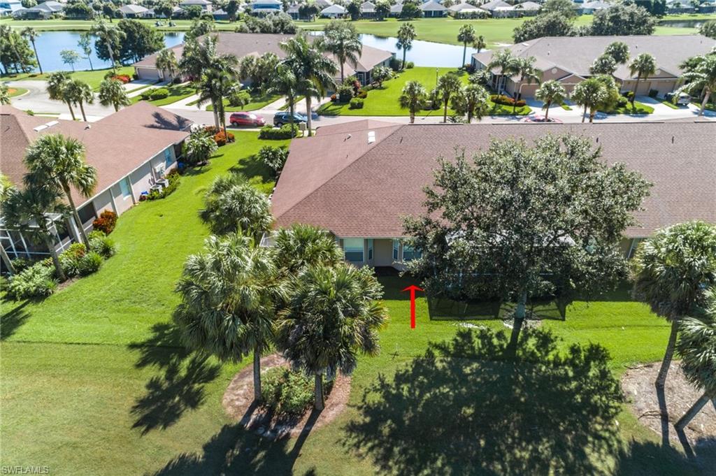21520 Portrush Run Estero, FL 33928 - Photo 31 of 34 an aerial view of a house with a garden and lake view