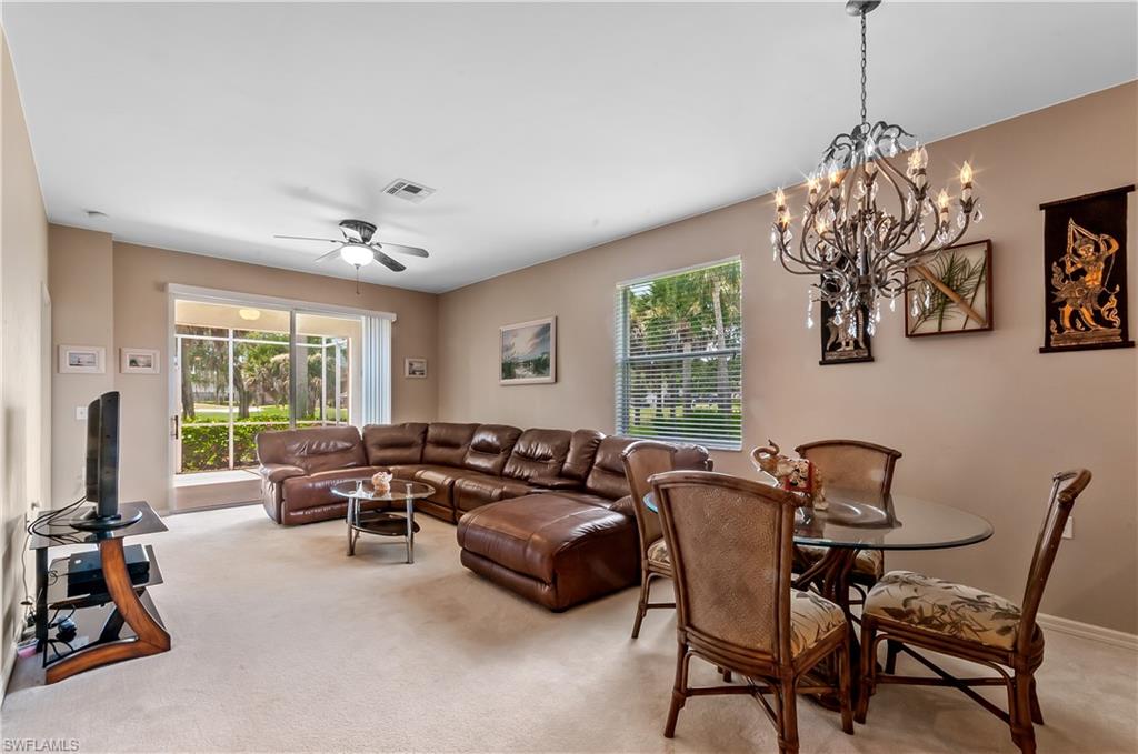 21520 Portrush Run Estero, FL 33928 - Photo 5 of 34 a living room with furniture and a large window