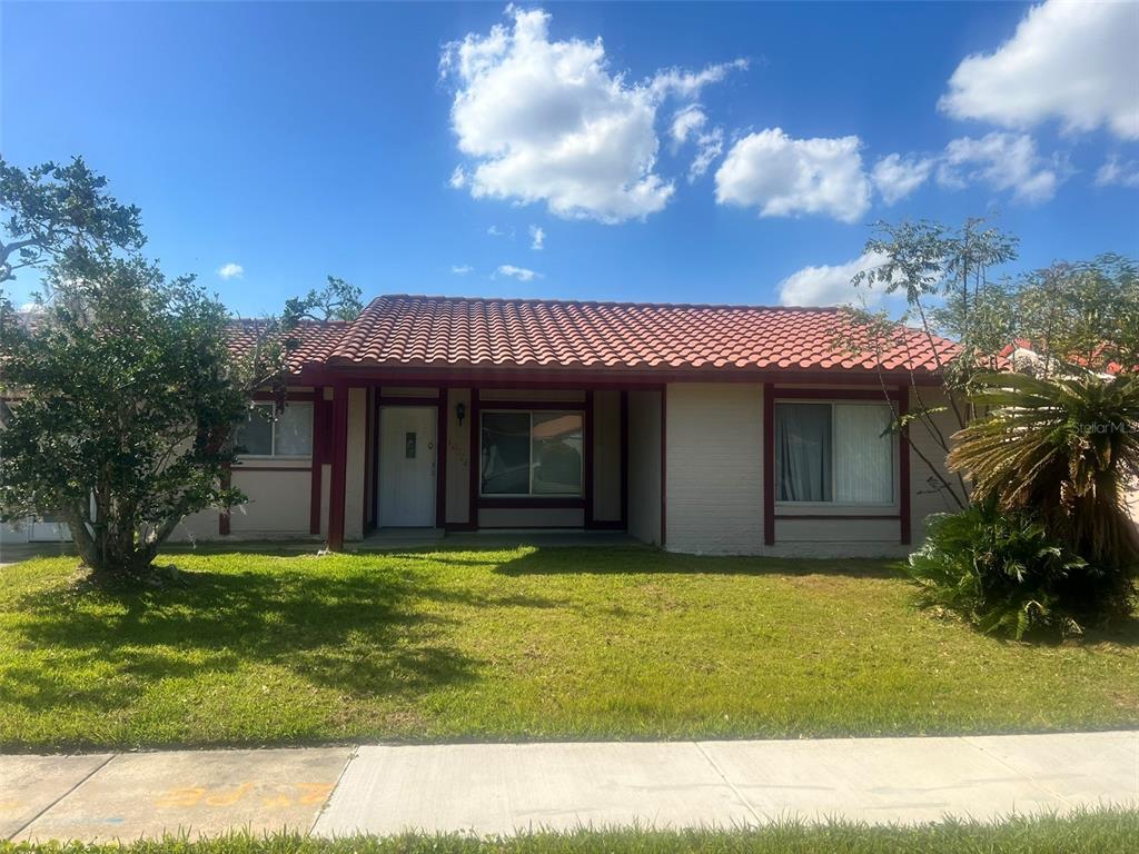 10528 Montpelier Circle Orlando, FL 32821 - Photo 1 of 1 a view of a house with a yard