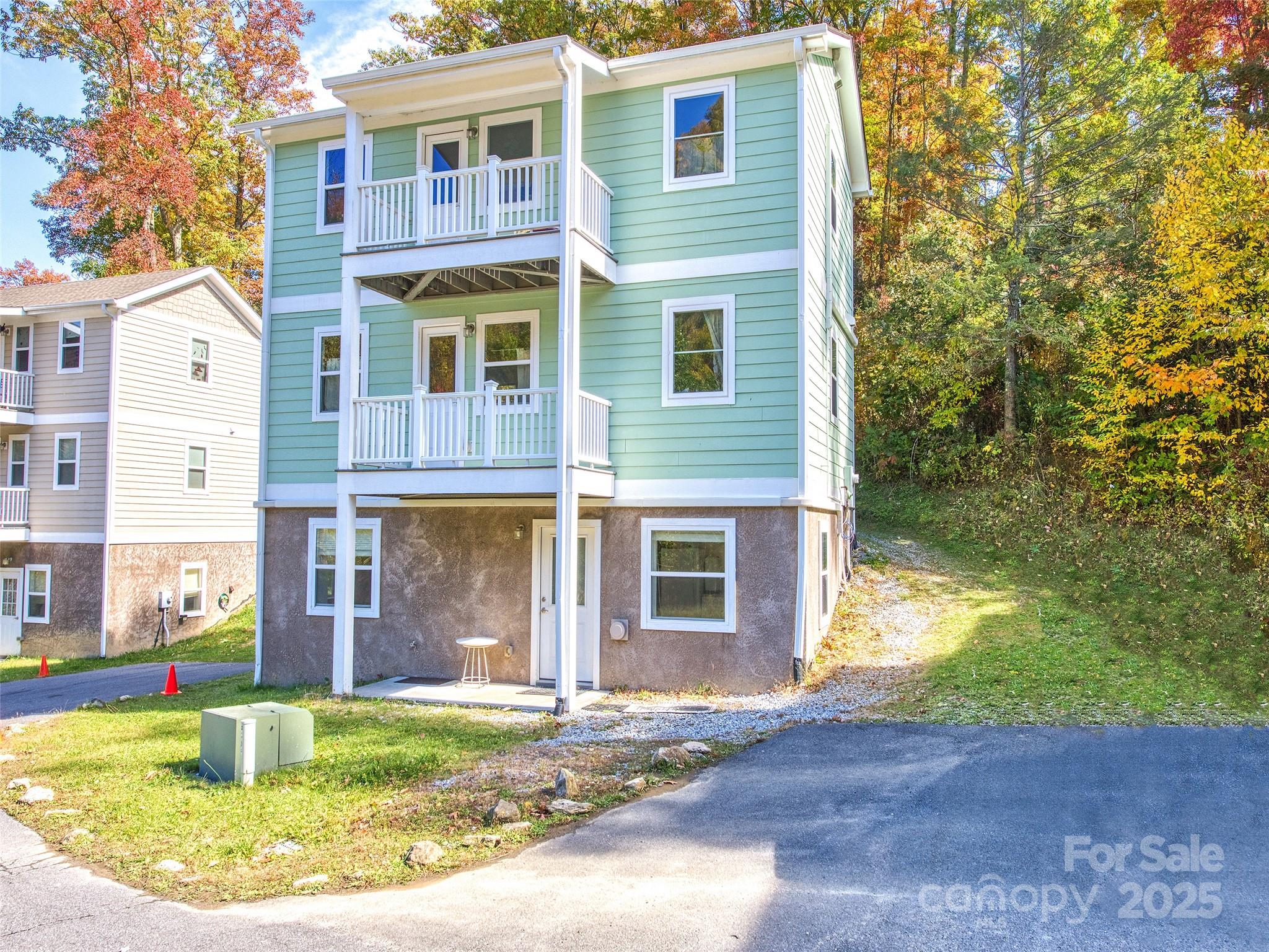 12 Lila Lane Leicester, NC 28748 - Photo 1 of 33 a view of a house with backyard and sitting area