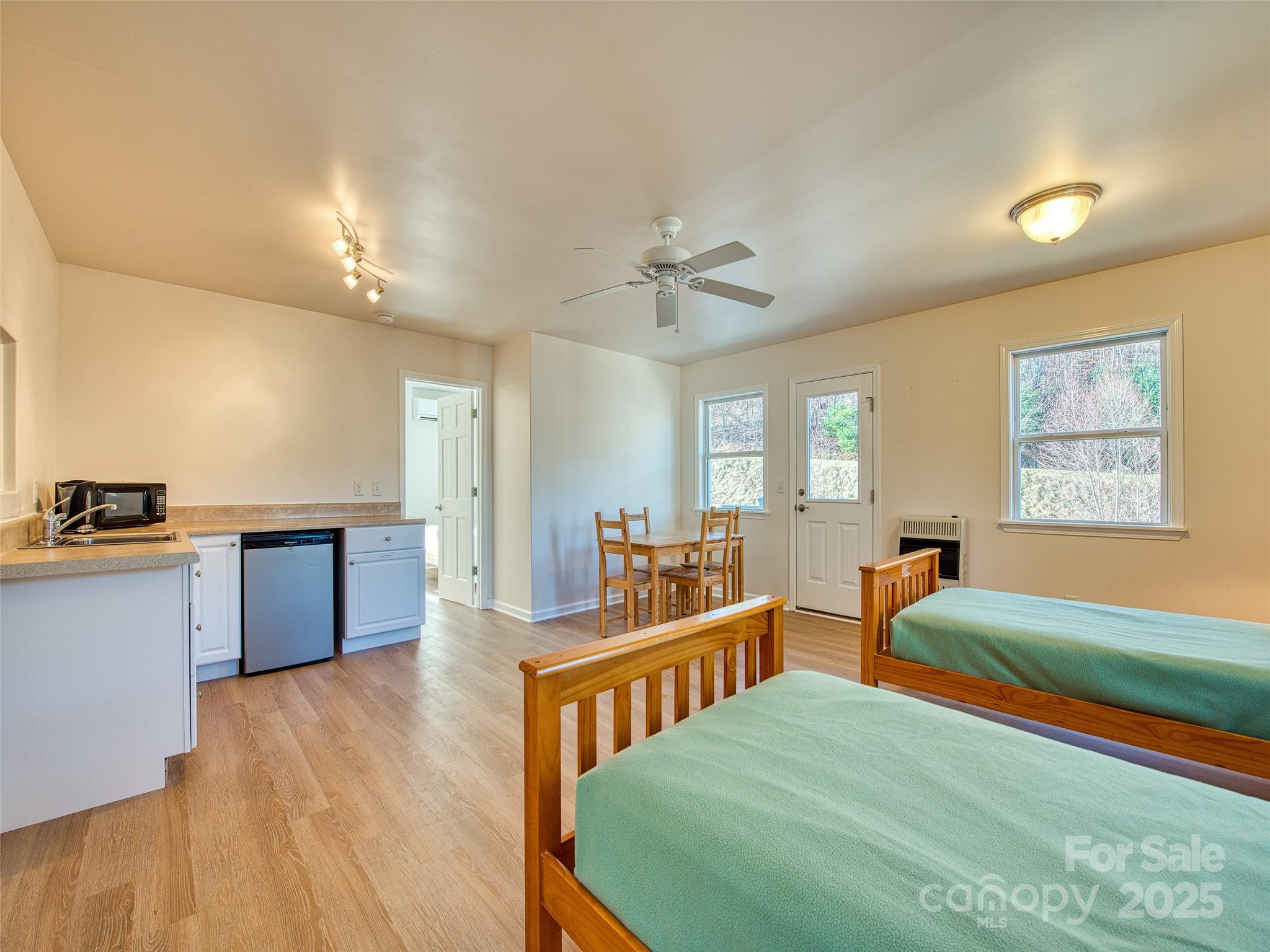 12 Lila Lane Leicester, NC 28748 - Photo 14 of 33 a large bedroom with bed and a view of kitchen