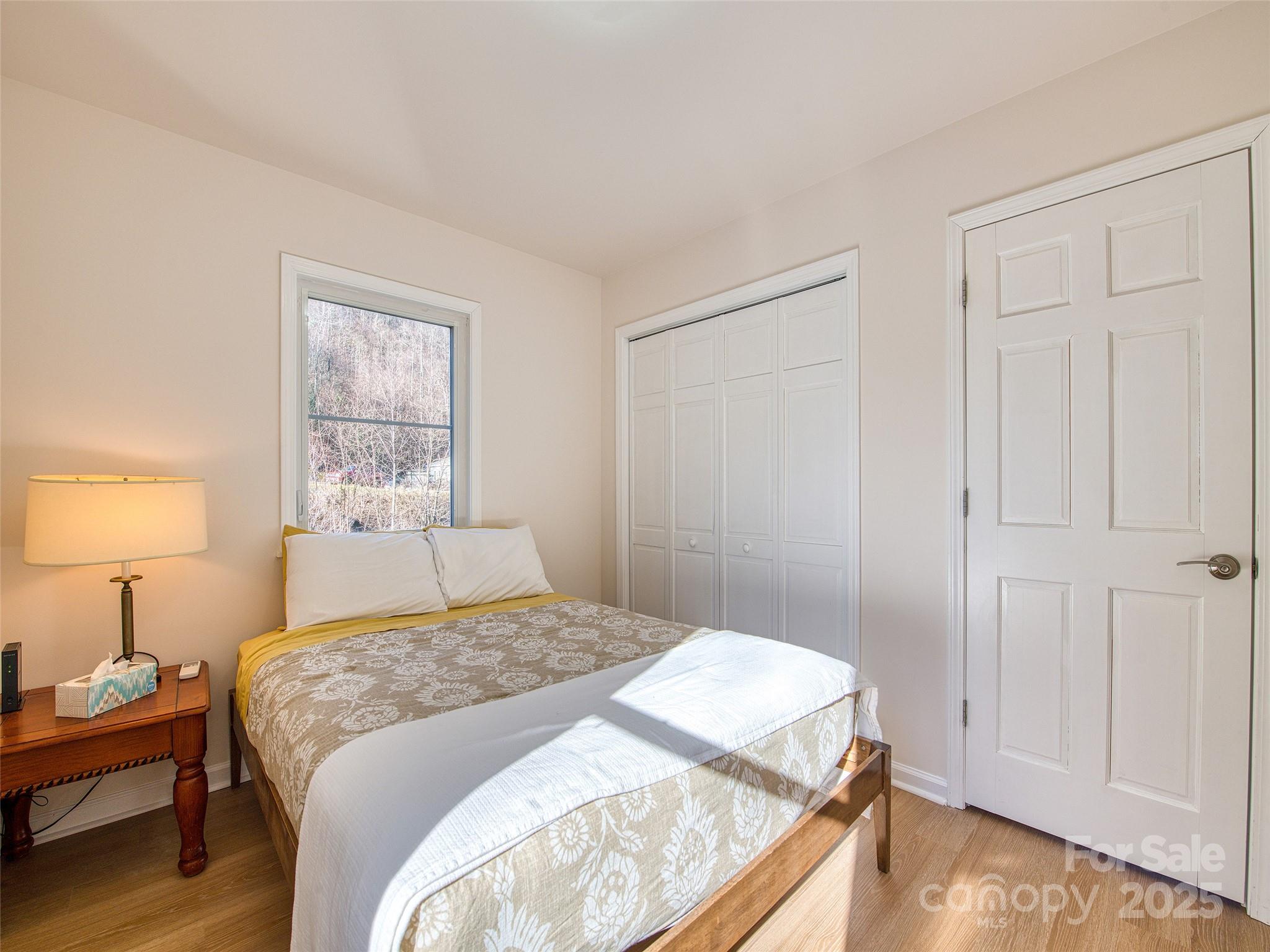 12 Lila Lane Leicester, NC 28748 - Photo 17 of 33 a bedroom with a bed and a window