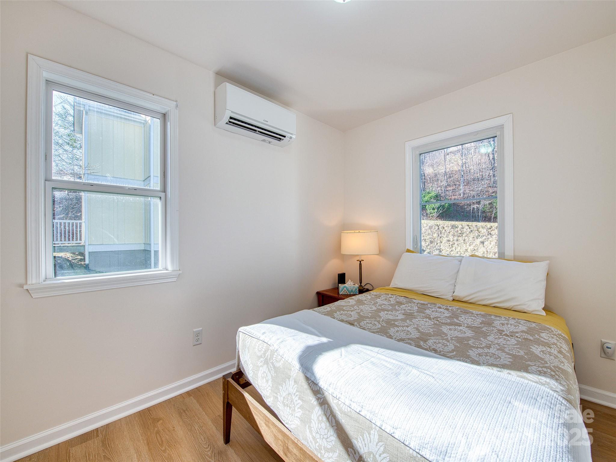 12 Lila Lane Leicester, NC 28748 - Photo 18 of 33 a bedroom with a bed and a window