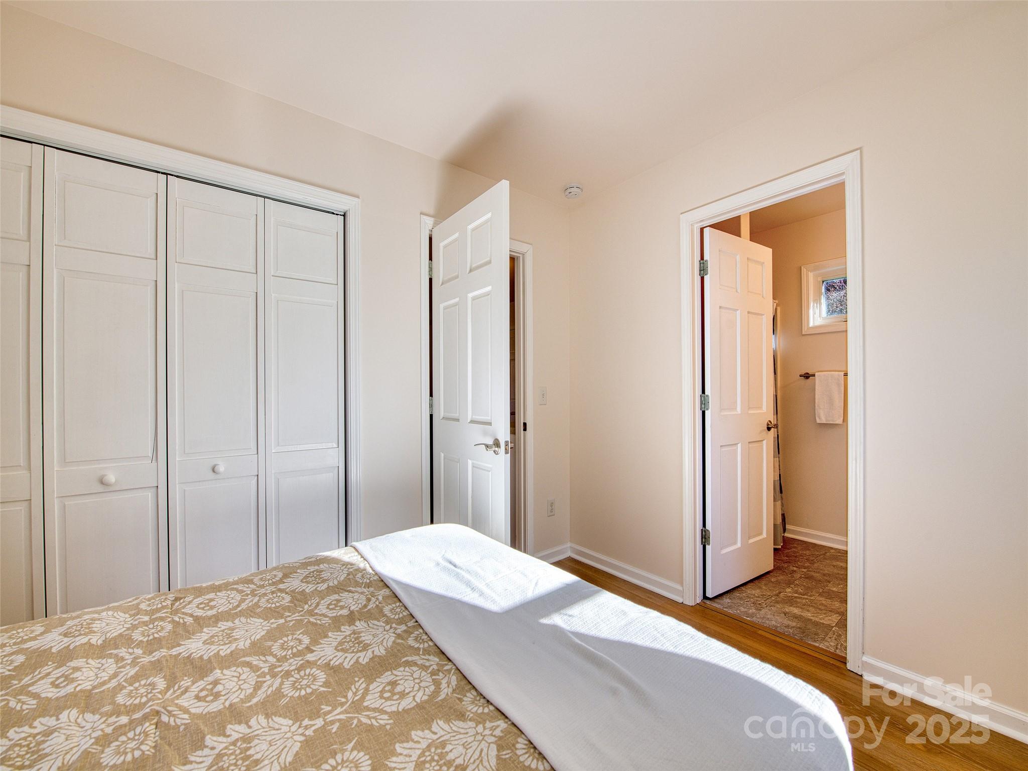 12 Lila Lane Leicester, NC 28748 - Photo 19 of 33 a bedroom with a bed and a mirror