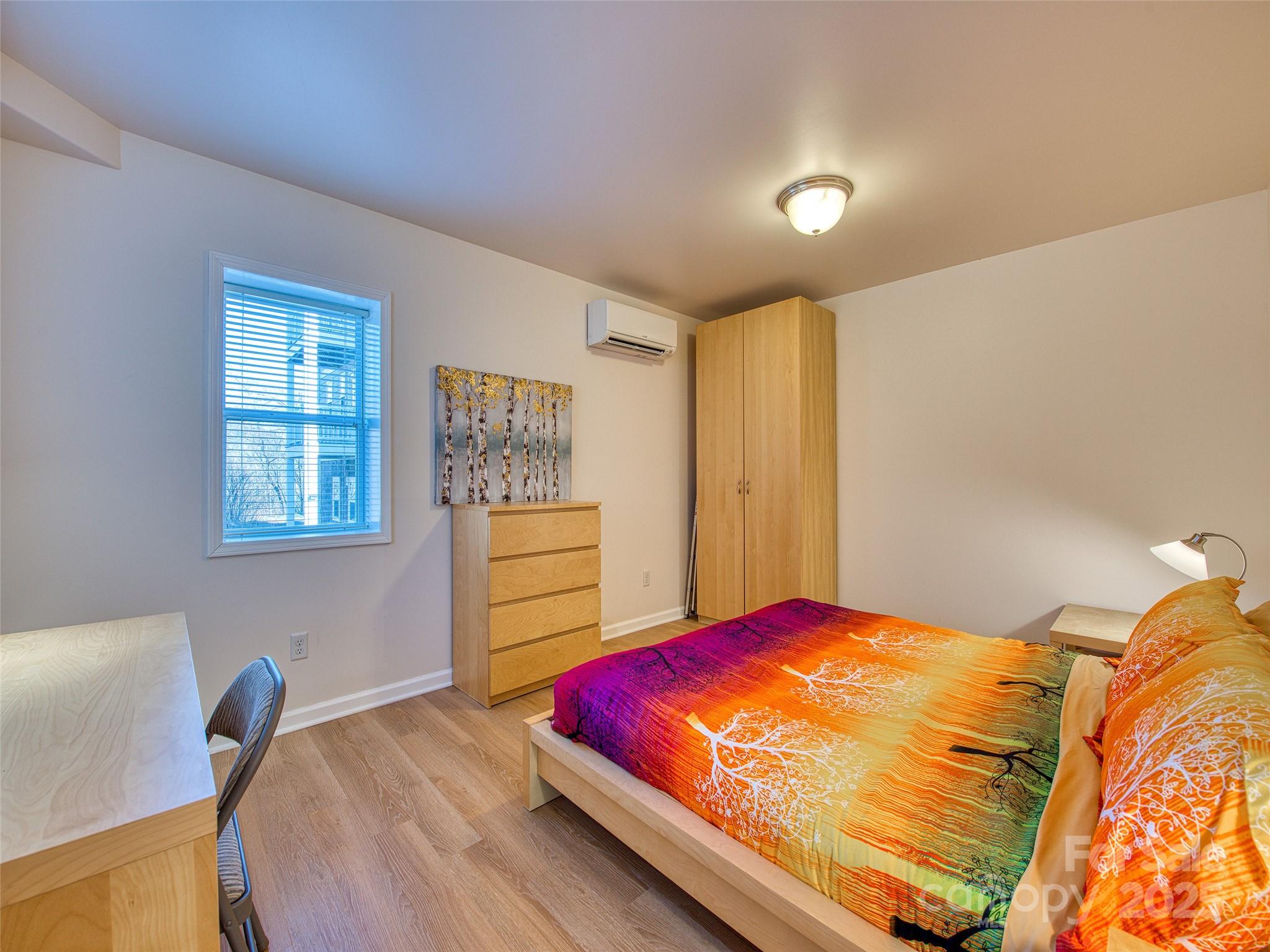 12 Lila Lane Leicester, NC 28748 - Photo 23 of 33 a bedroom with a bed and window