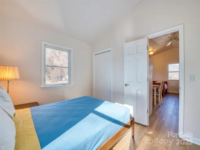 a bedroom with a bed and a view of bedroom