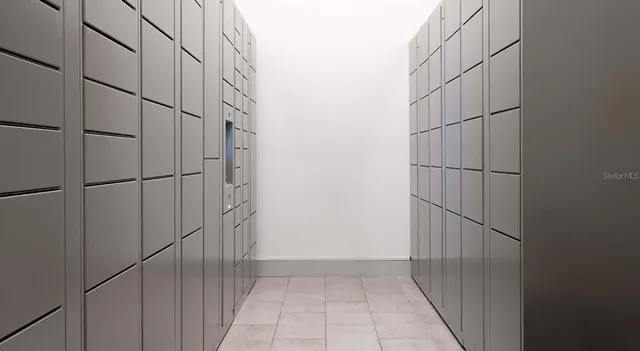 a living room with table and a flat screen tv