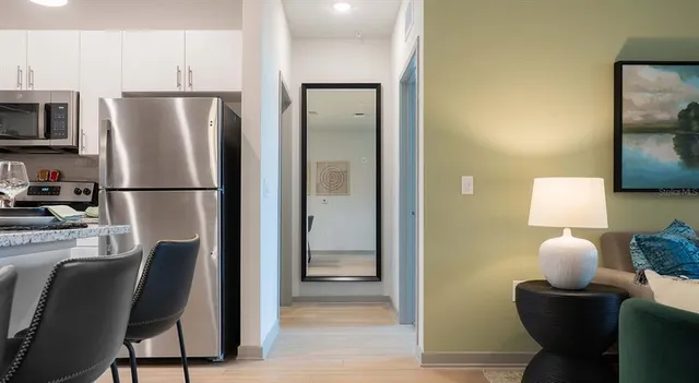 a bedroom with a bed and a night stand