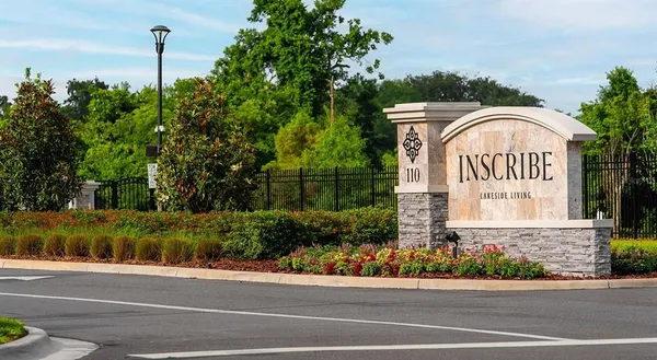 a view of a pathway both side of house