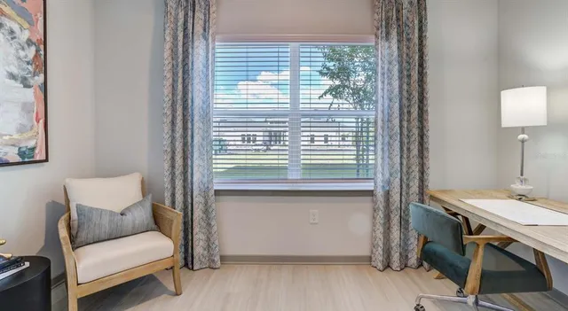 a bedroom with bed and window