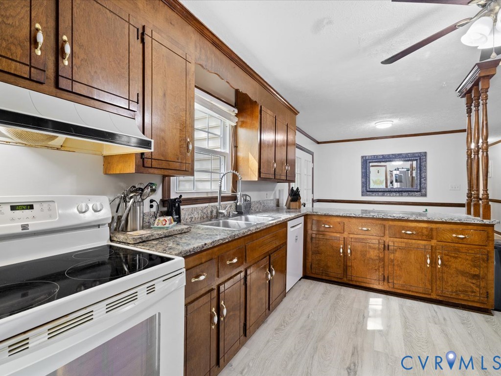 4411 Overridge Drive Chester, VA 23831 - Photo 12 of 35 a kitchen with stainless steel appliances granite countertop a sink stove and cabinets