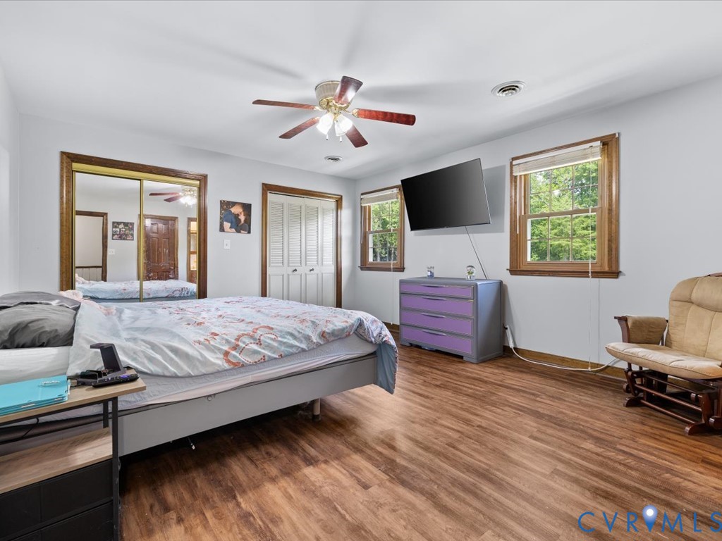 4411 Overridge Drive Chester, VA 23831 - Photo 22 of 35 a bedroom with a bed and a chandelier