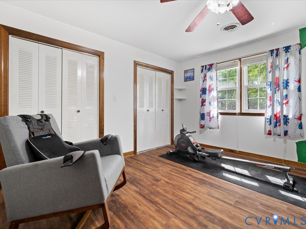 4411 Overridge Drive Chester, VA 23831 - Photo 28 of 35 a room with furniture gym equipment and a large window
