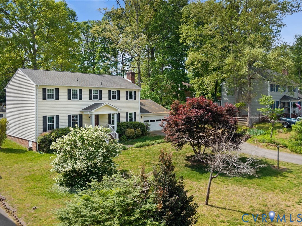 4411 Overridge Drive Chester, VA 23831 - Photo 30 of 35 a front view of a house with a garden