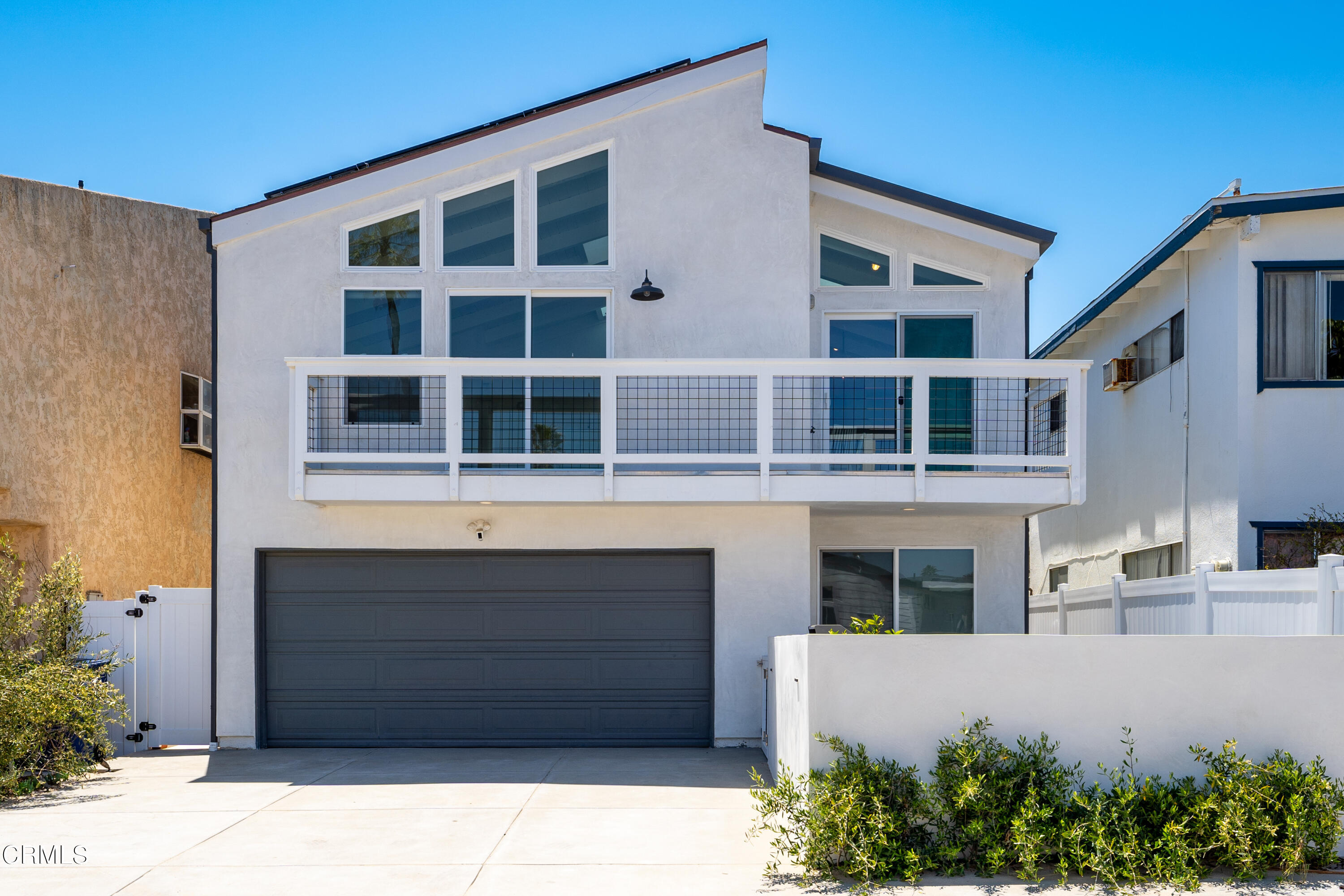 4169 Sunset Lane Oxnard, CA 93035 - Photo 1 of 56 a front view of a building with a garden