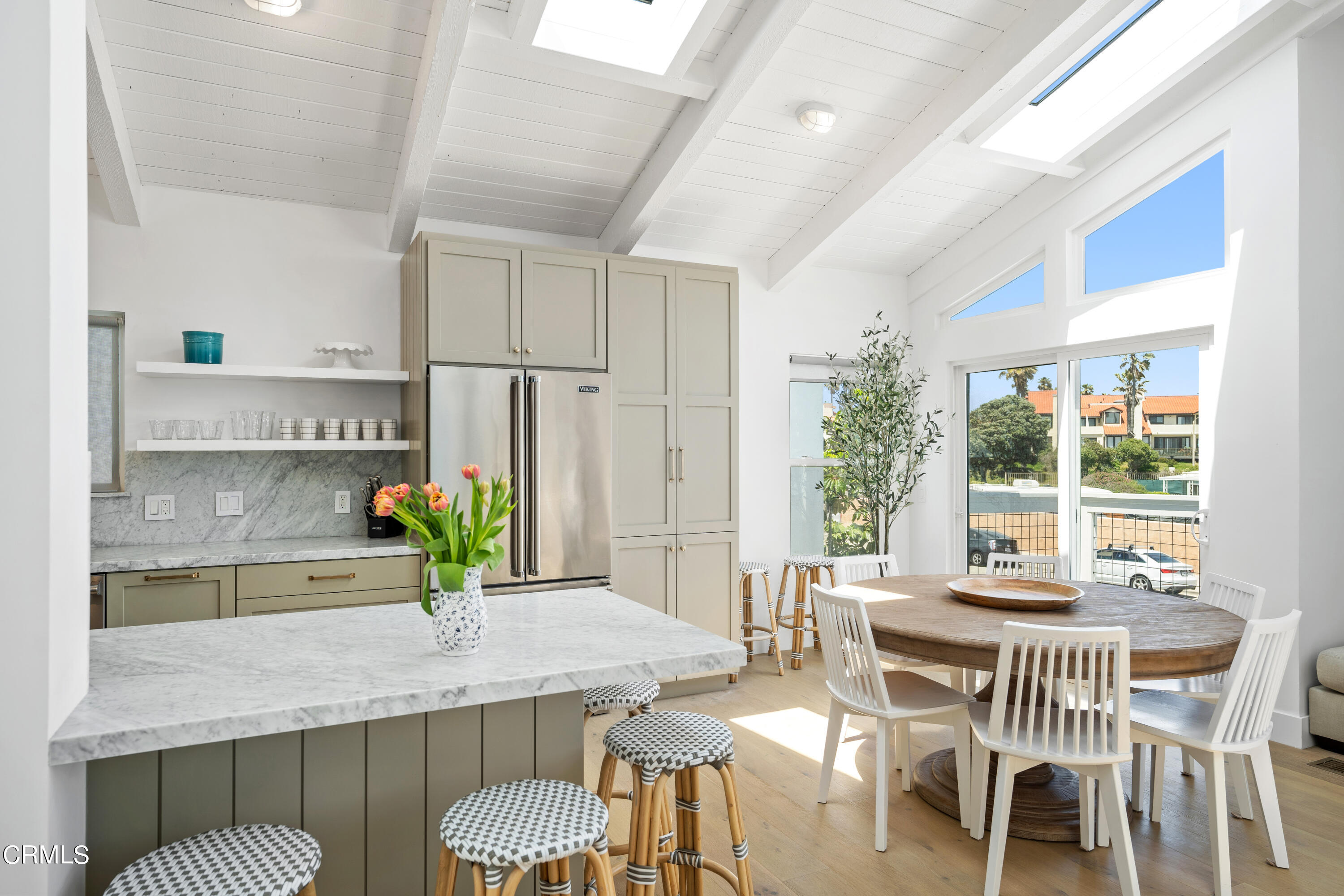 4169 Sunset Lane Oxnard, CA 93035 - Photo 18 of 56 a view of a dining room with furniture and a potted plant