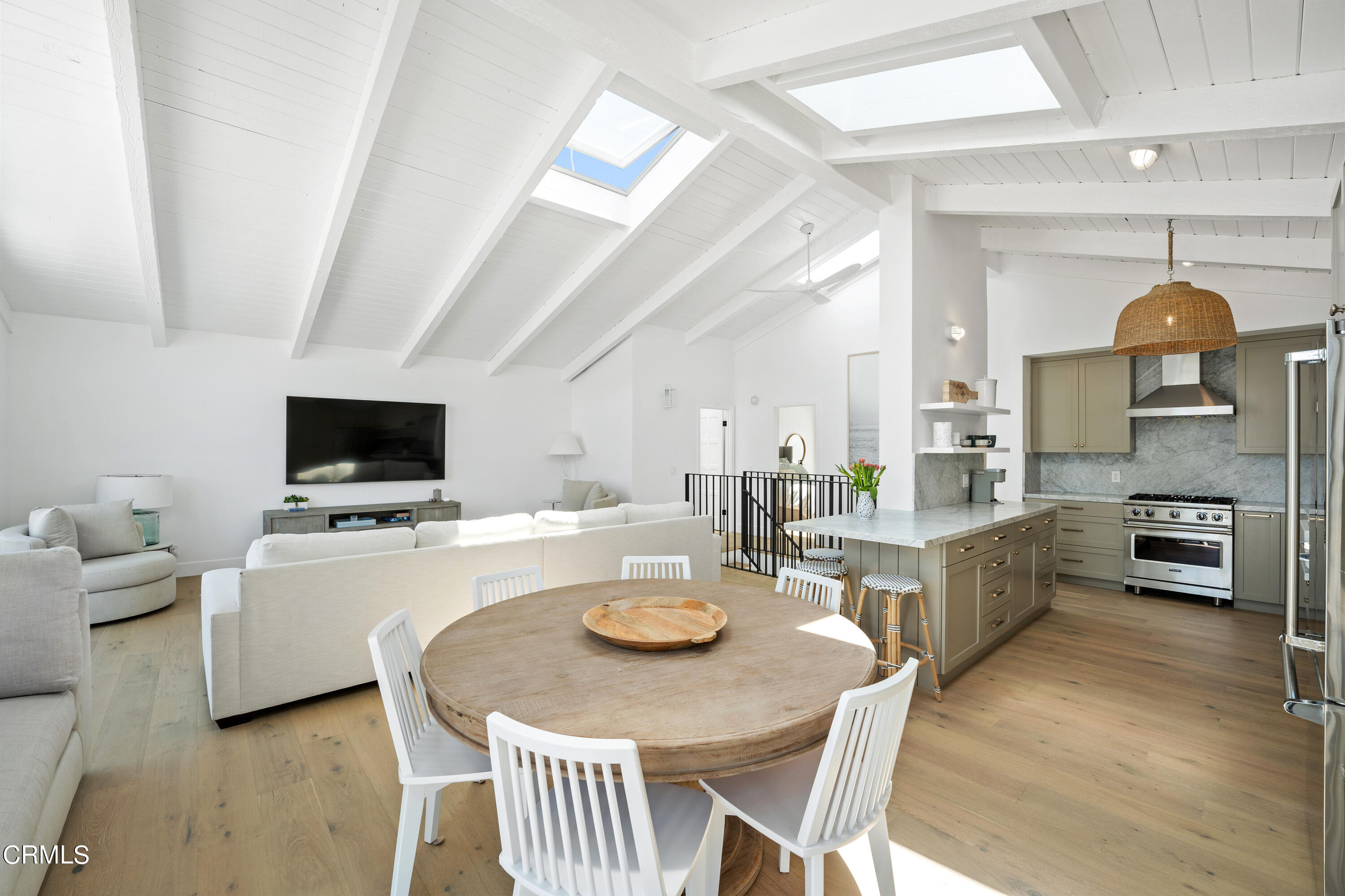 4169 Sunset Lane Oxnard, CA 93035 - Photo 20 of 56 a large kitchen with a table chairs and a refrigerator