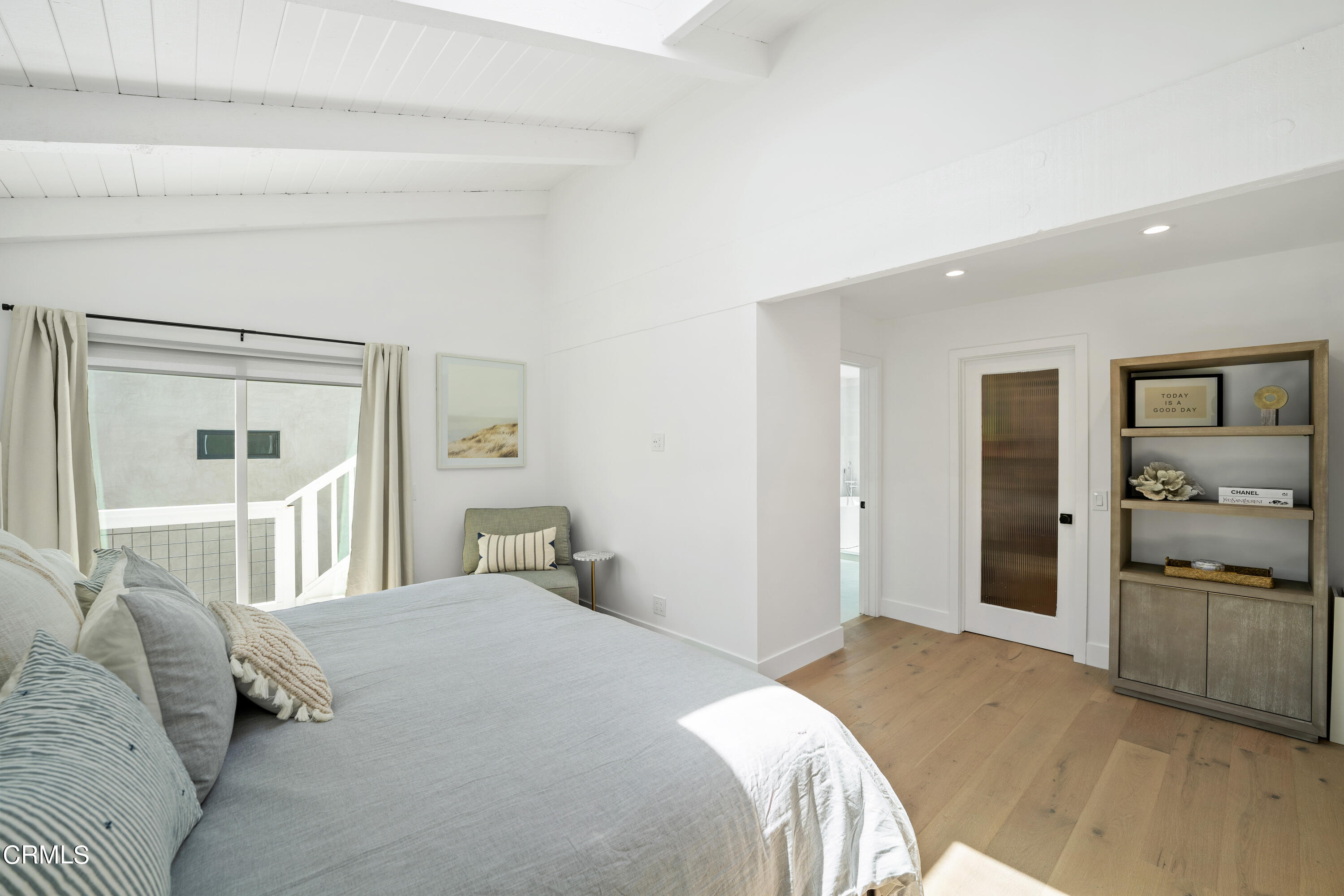 4169 Sunset Lane Oxnard, CA 93035 - Photo 27 of 56 a bedroom with a large bed and painting on the wall