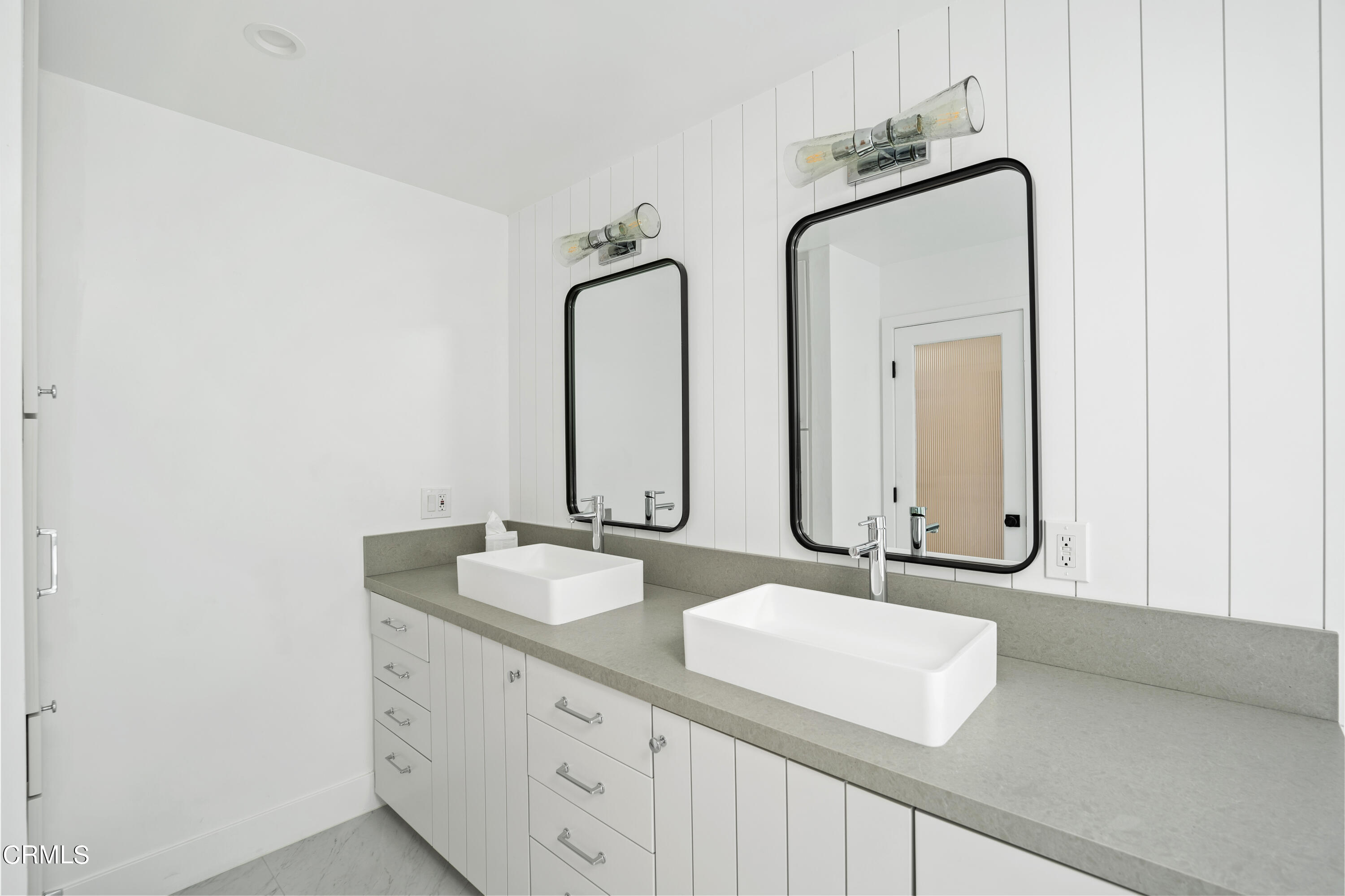 4169 Sunset Lane Oxnard, CA 93035 - Photo 28 of 56 a bathroom with double vanity sinks and a mirror