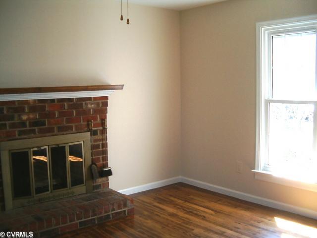 5506 Chanson Road Richmond, VA 23237 - Photo 6 of 12 Dining Room - Pic. 1 - Dining Room with Brick Wood Burning Fireplace, Freshly Painted, Wood Flooring Refinished, & Ceiling Fan.