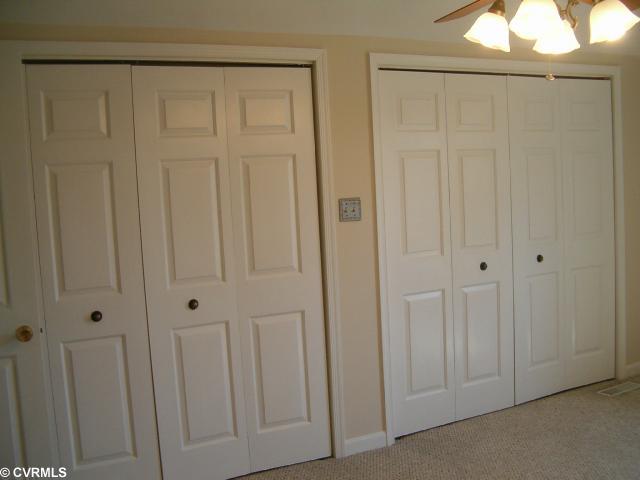 5506 Chanson Road Richmond, VA 23237 - Photo 8 of 12 Master Bedroom - Spacious Master Bedroom with Ceiling Fan, Door to Huge Storage Area, Large Closet w/ 2 Sets of Doors, and NEW CARPET.
