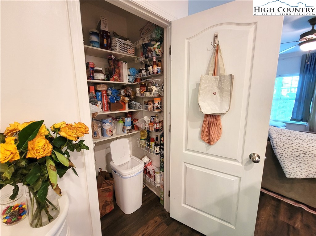 107 Stratford Lane, Unit 24B Boone, NC 28607 - Photo 12 of 45 a white toilet sitting next to a bathroom sink and vanity