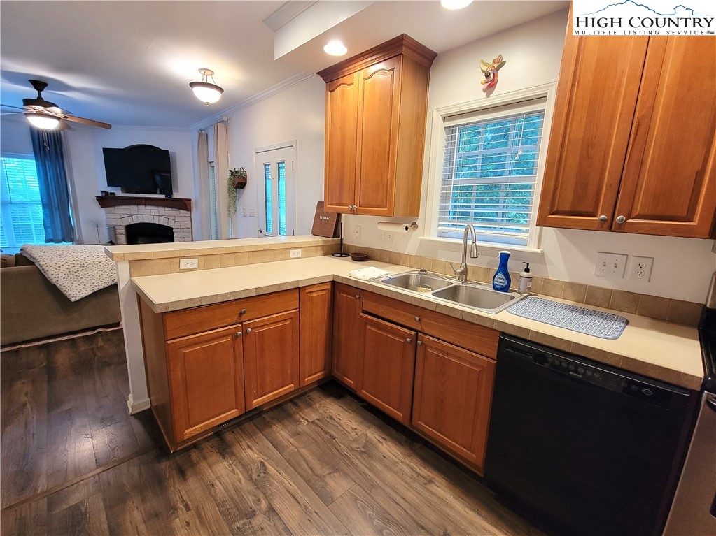 107 Stratford Lane, Unit 24B Boone, NC 28607 - Photo 17 of 45 a kitchen with stainless steel appliances granite countertop a sink a stove and a microwave