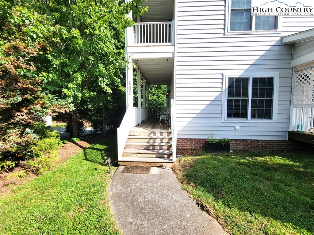 107 Stratford Lane, Unit 24B Boone, NC 28607 - Photo 3 of 45 a front view of a house with a yard