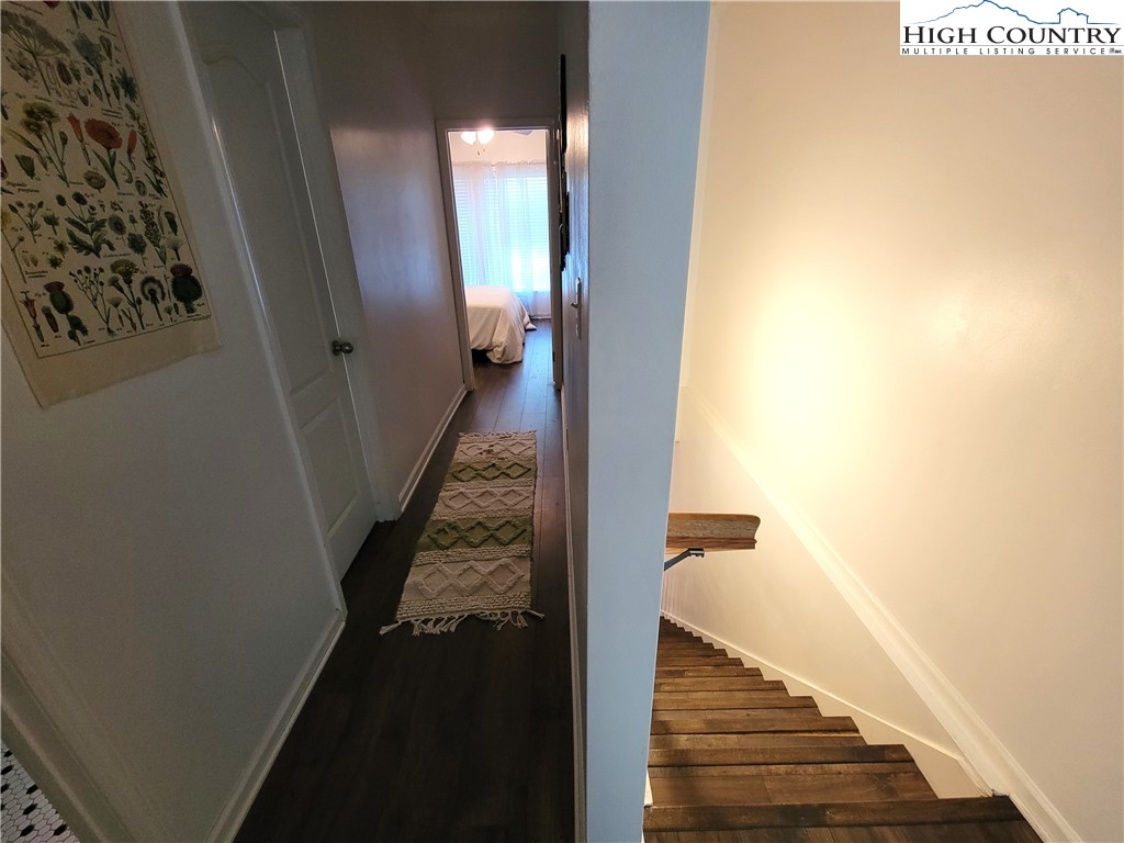 107 Stratford Lane, Unit 24B Boone, NC 28607 - Photo 36 of 45 a view of a hallway with wooden floor and entryway
